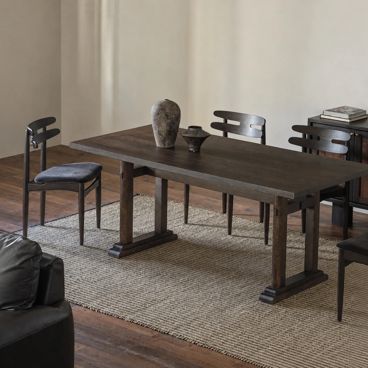 Dark timber Hane dining chairs gathered around a Maku dining table