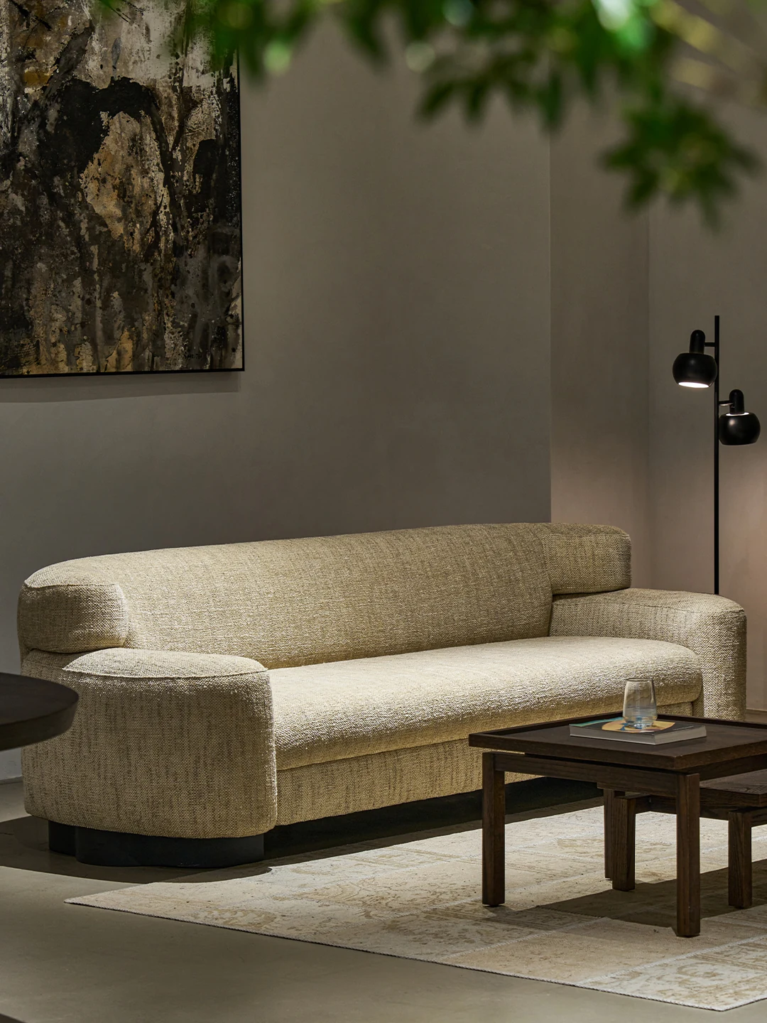Pale woven Iwa sofa in a restrained living room