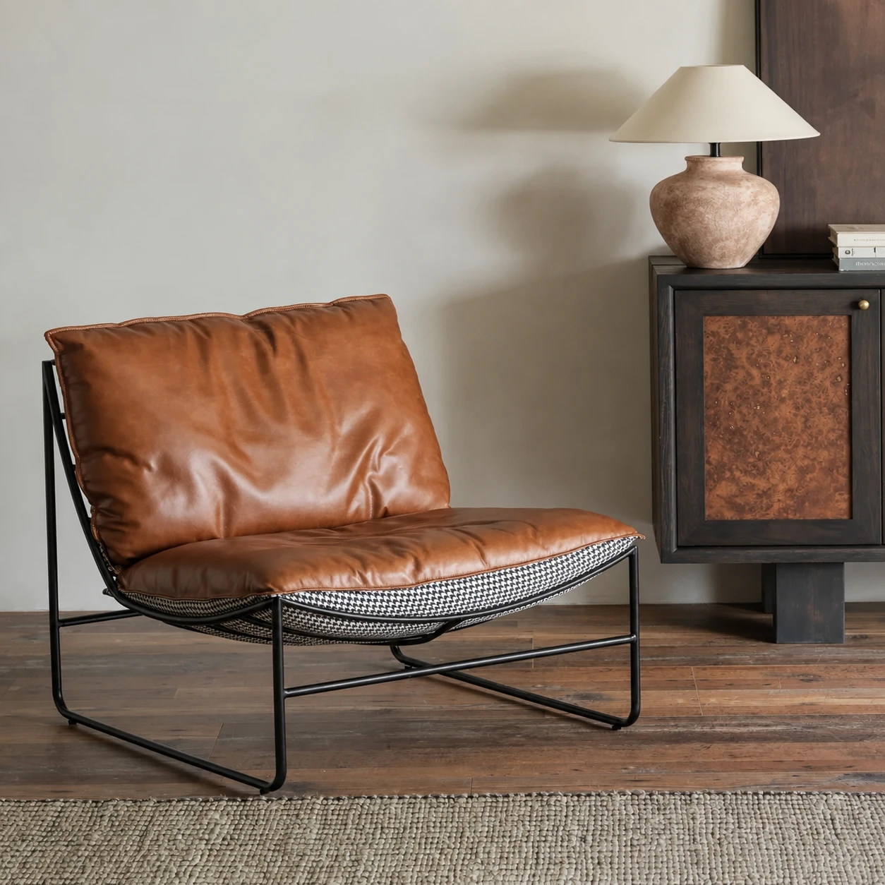 Kake leather lounge chair in a warm, softly lit interior