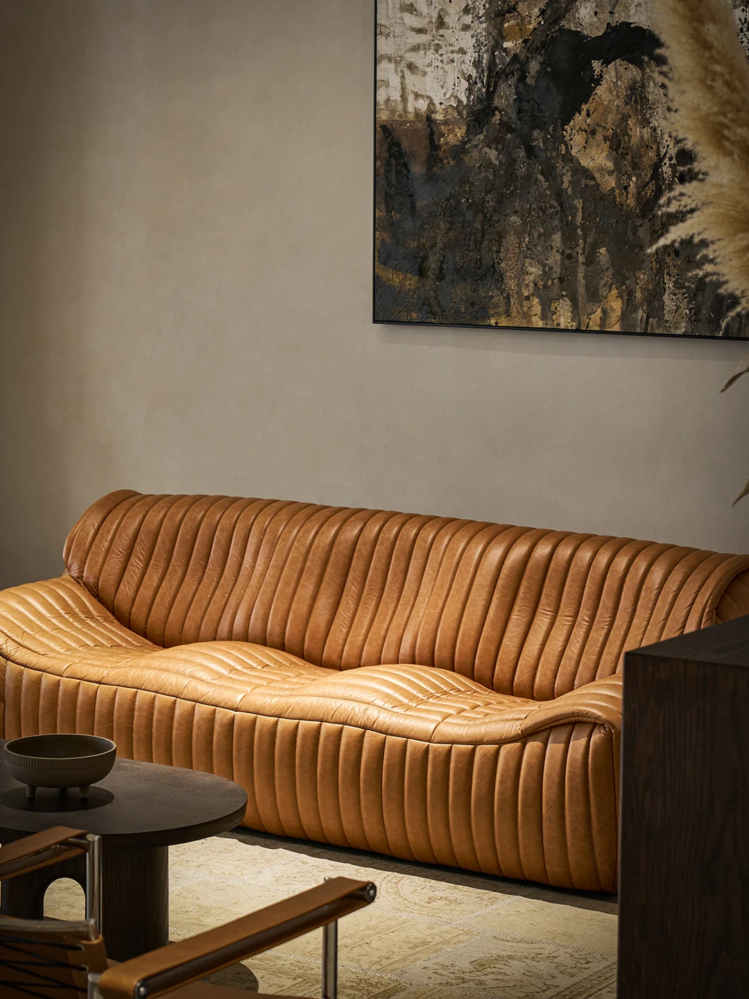 Channelled tan leather Nami sofa in warm evening light